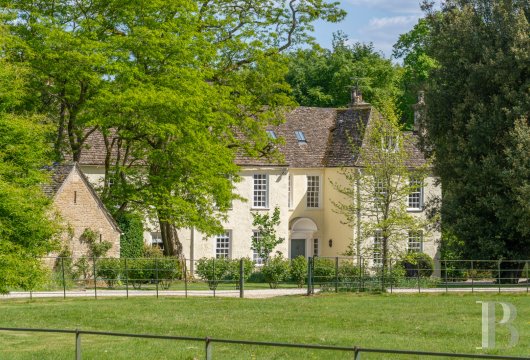 In Beverston, Gloucestershire, a Georgian house dating from 1729, with a separate cottage and some 1.64 hectares ...